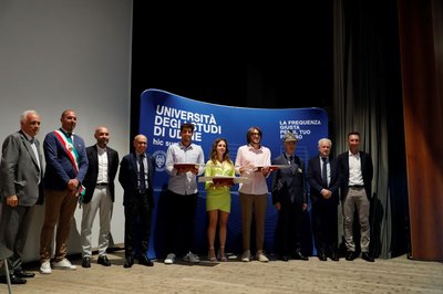 Foto di gruppo con i vincitori del premio: (da sin.) Battiston, Tuan e Stefani